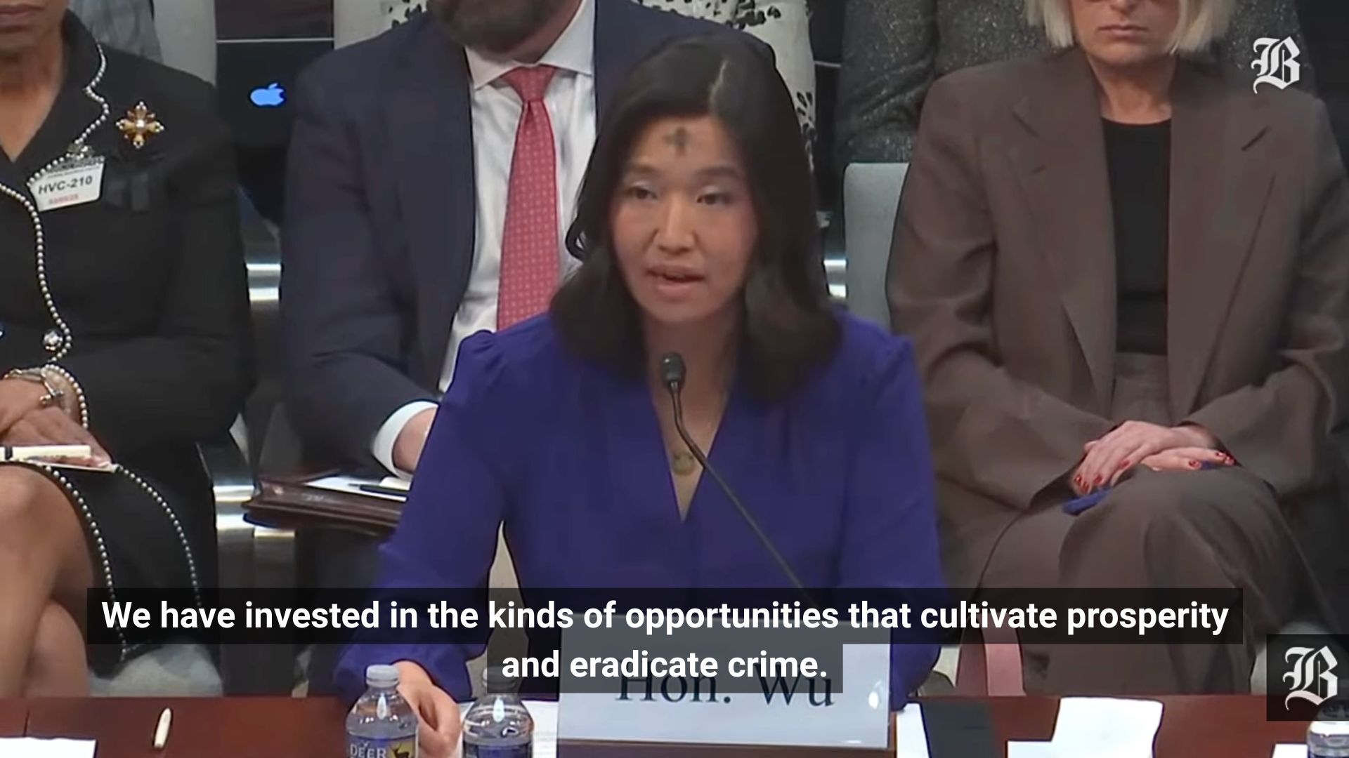 Still of Boston Mayor Michelle Wu saying, "We have invested in the kinds of opportunities that cultivate prosperity and eradicate crime," during a Congressional hearing.